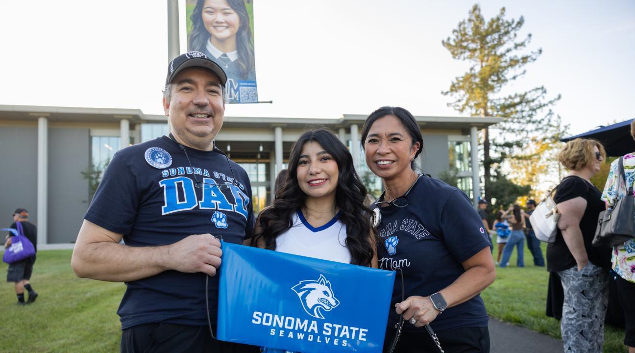 Parents and Student with Sonoma State sign 