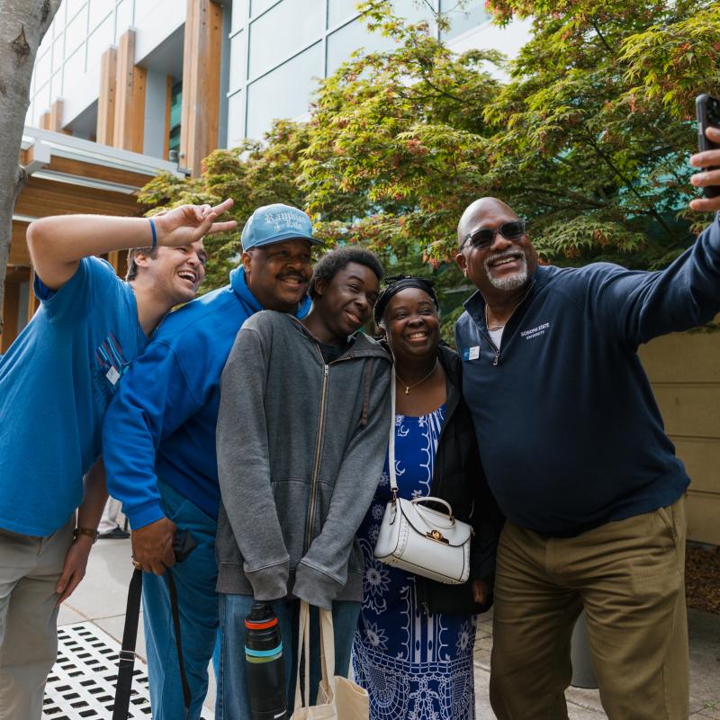 group of people taking a photo of themselves